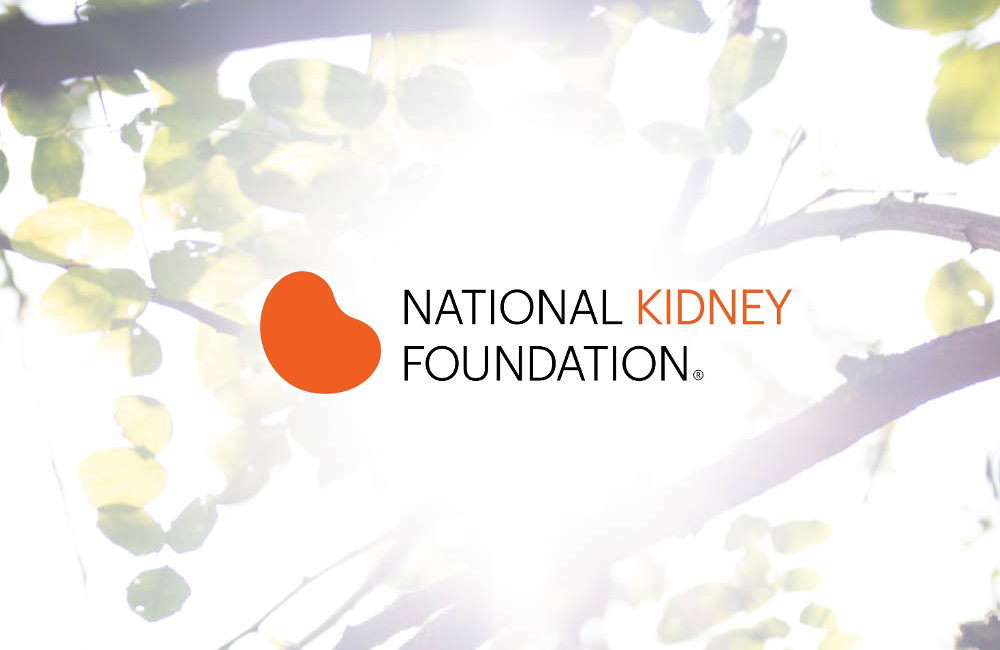 NKF Logo in front of tree branches