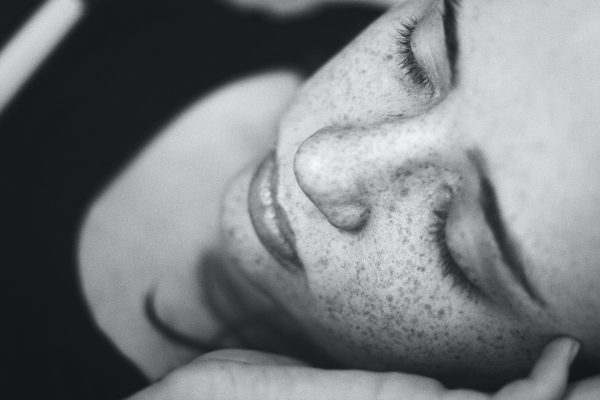 Black & white close-up of girl sleeping